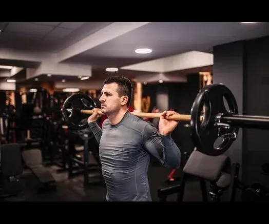 Barbell back squat in the Kaeos weight room